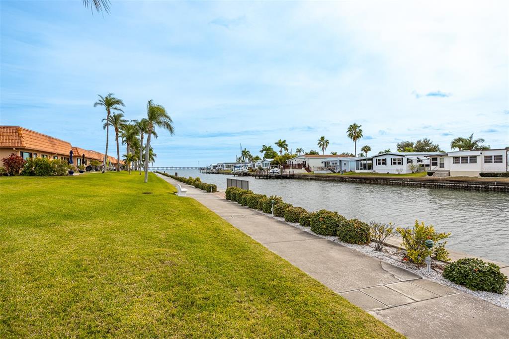 19029 US Highway 19 North, Unit 10C Clearwater, FL 33764 - Photo 34 of 61 a view of a lake with boats and trees in the background