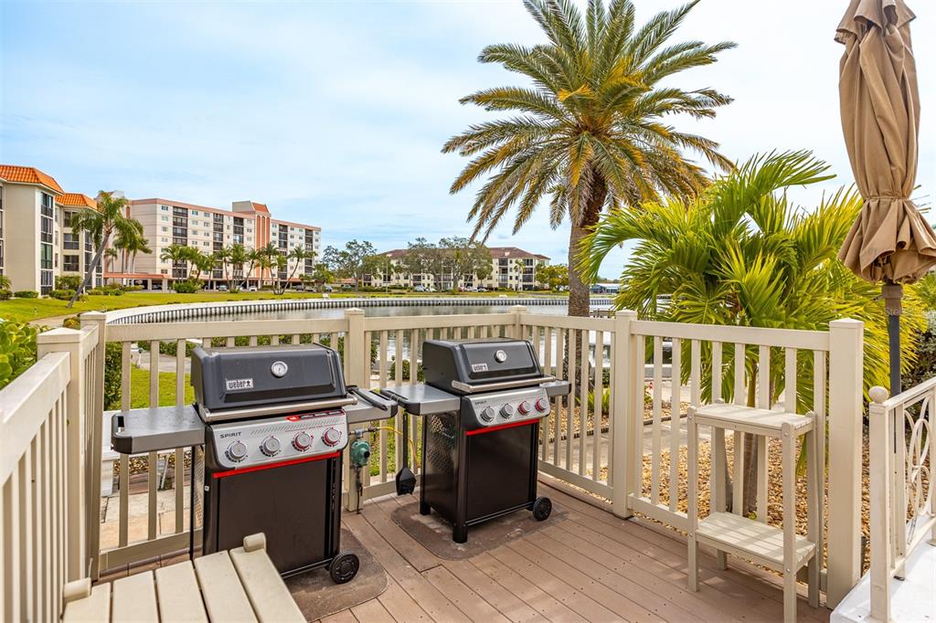 19029 US Highway 19 North, Unit 10C Clearwater, FL 33764 - Photo 49 of 61 a view of a balcony with wooden floor and outdoor seating