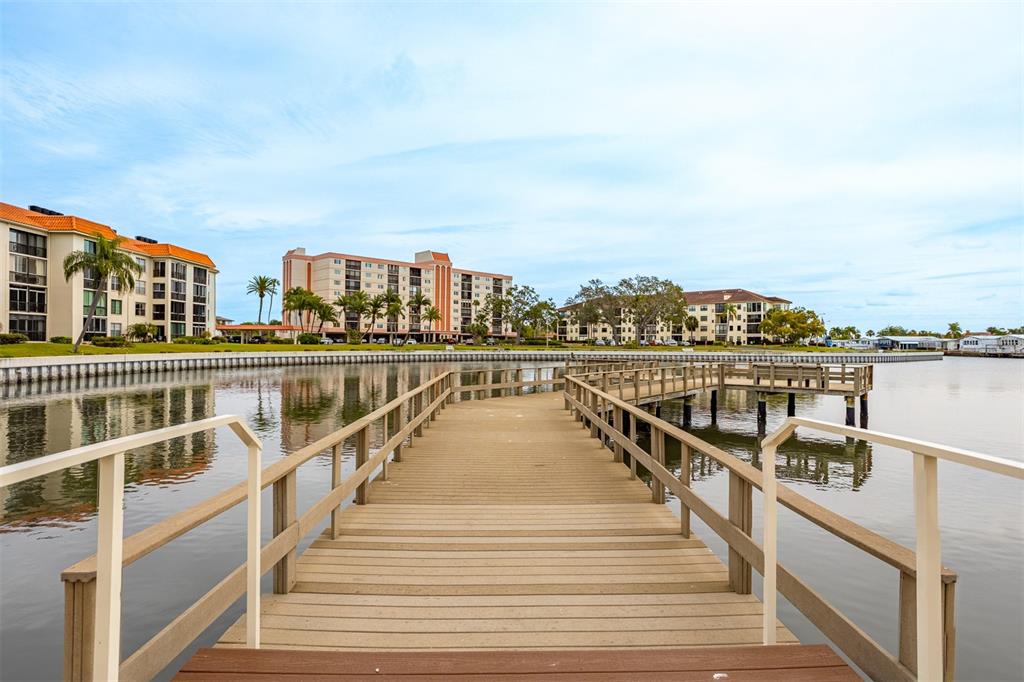 19029 US Highway 19 North, Unit 10C Clearwater, FL 33764 - Photo 59 of 61 a view of a balcony with wooden floor and city view