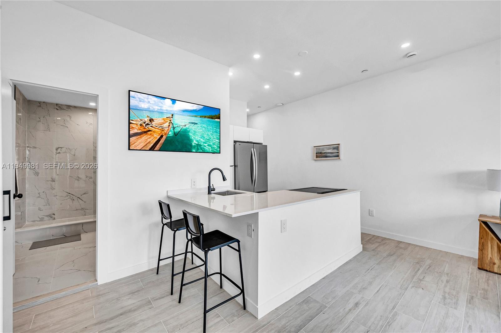 1500 Bay Road, Unit 1536S Miami Beach, FL 33139 - Photo 20 of 34 a view of a workspace with furniture and wooden floor
