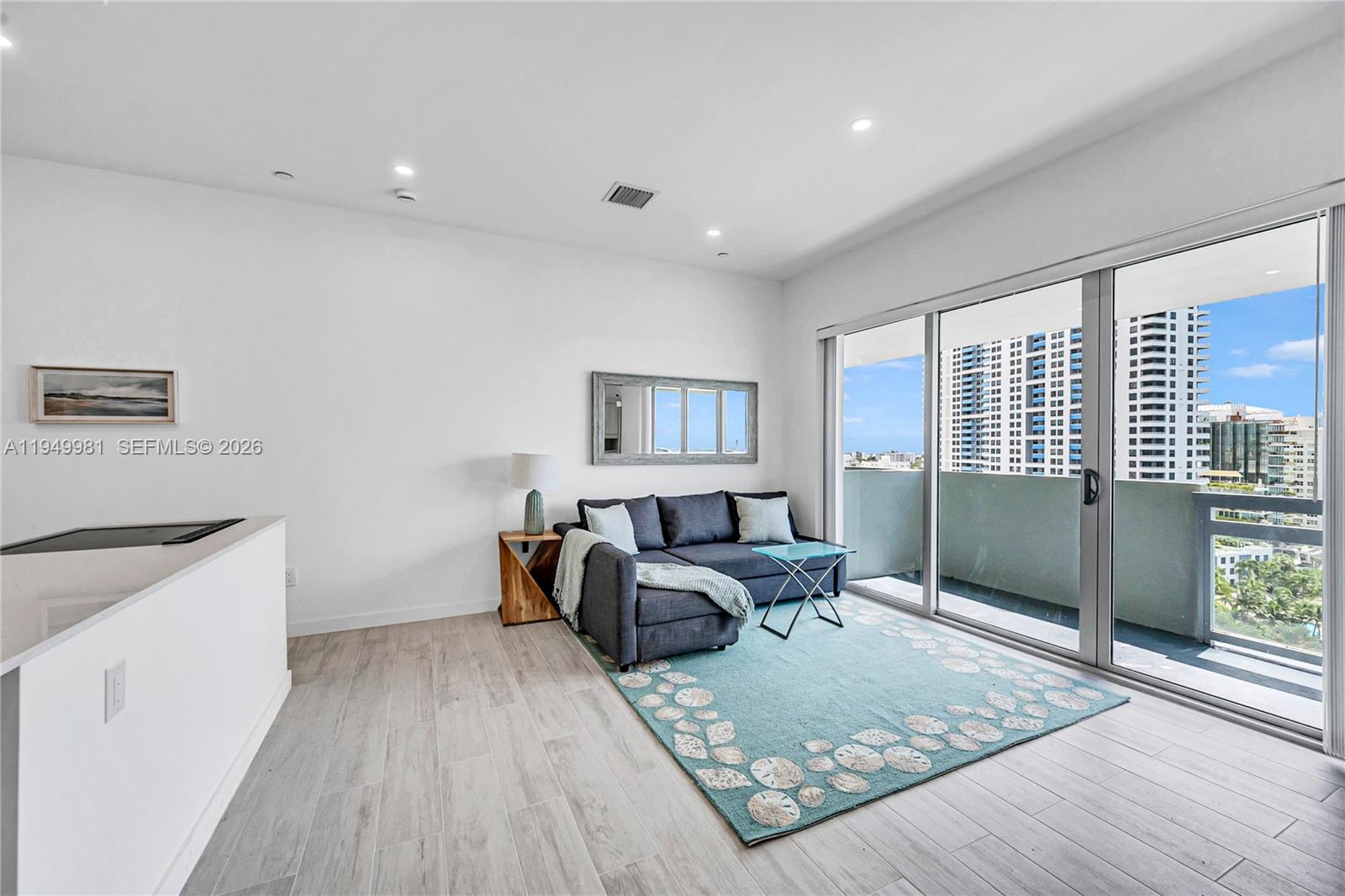 1500 Bay Road, Unit 1536S Miami Beach, FL 33139 - Photo 27 of 34 a spacious bedroom with a bed and wooden floor