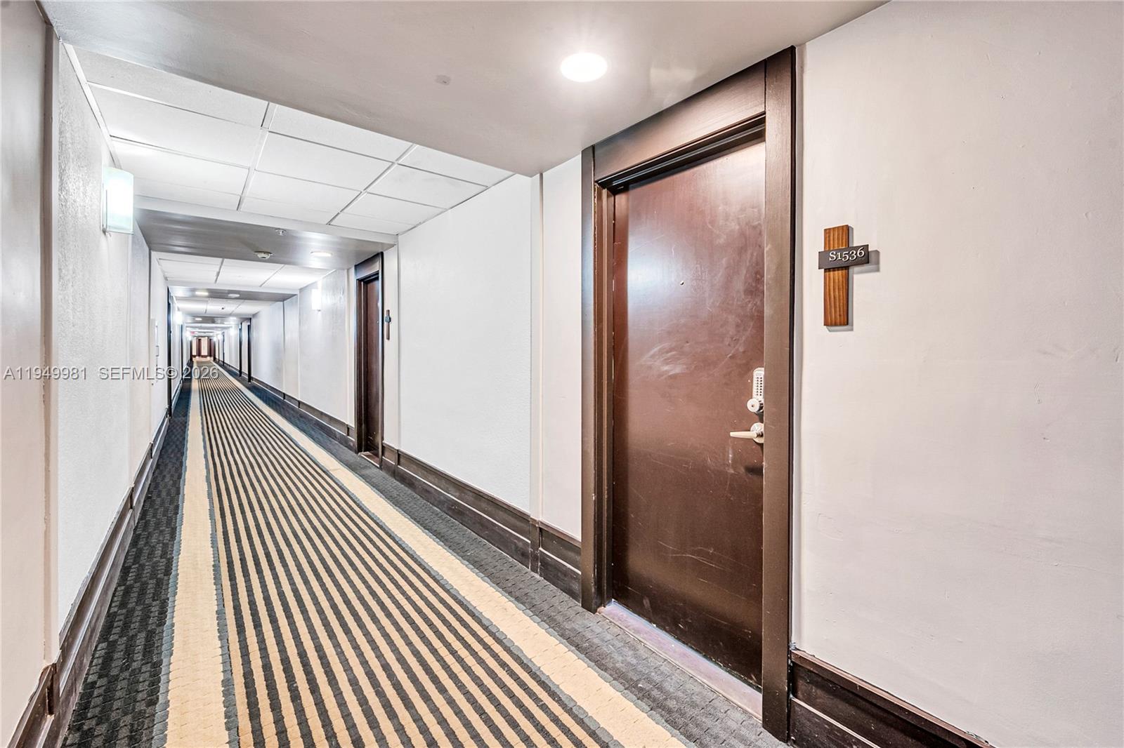 1500 Bay Road, Unit 1536S Miami Beach, FL 33139 - Photo 33 of 34 a view of a hallway with wooden floor