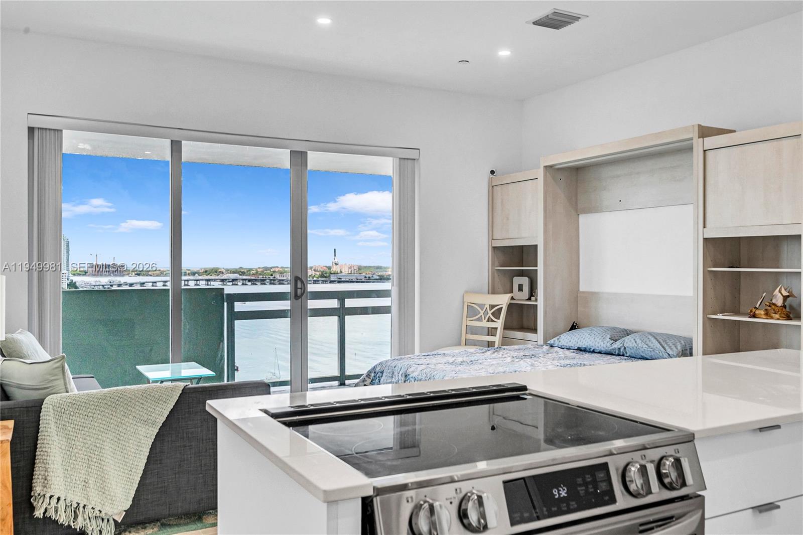 1500 Bay Road, Unit 1536S Miami Beach, FL 33139 - Photo 10 of 34 a kitchen with a sink and a view of living room