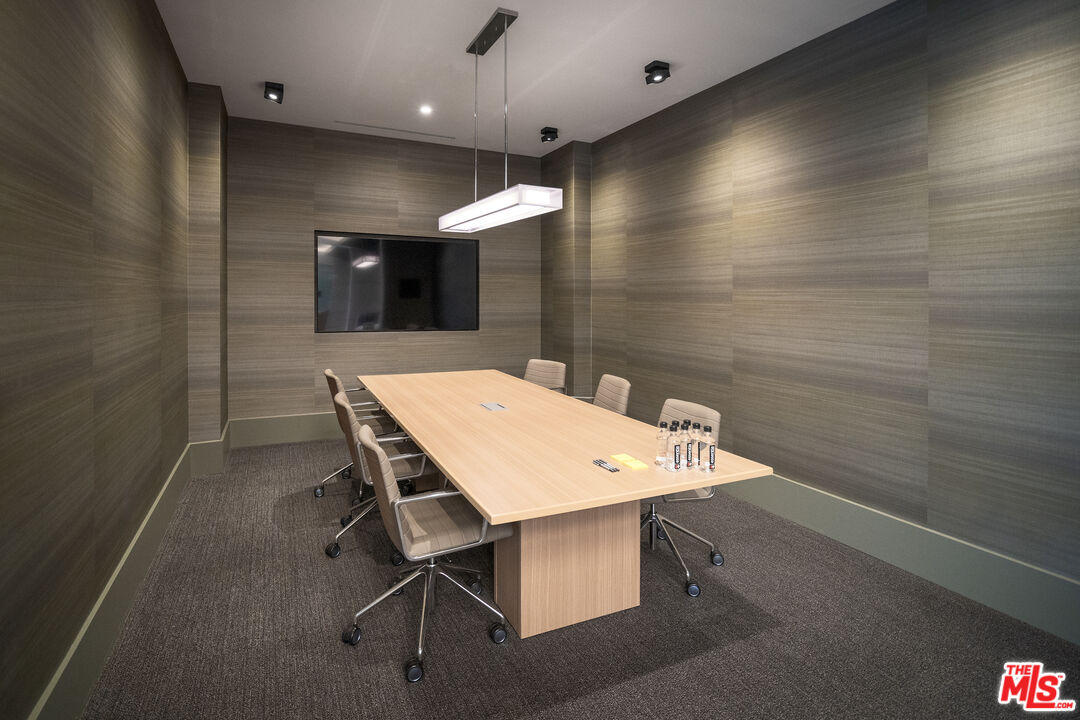 3688 Overland Avenue, Unit 312 Los Angeles, CA 90034 - Photo 28 of 33 a view of a table and chairs in a room