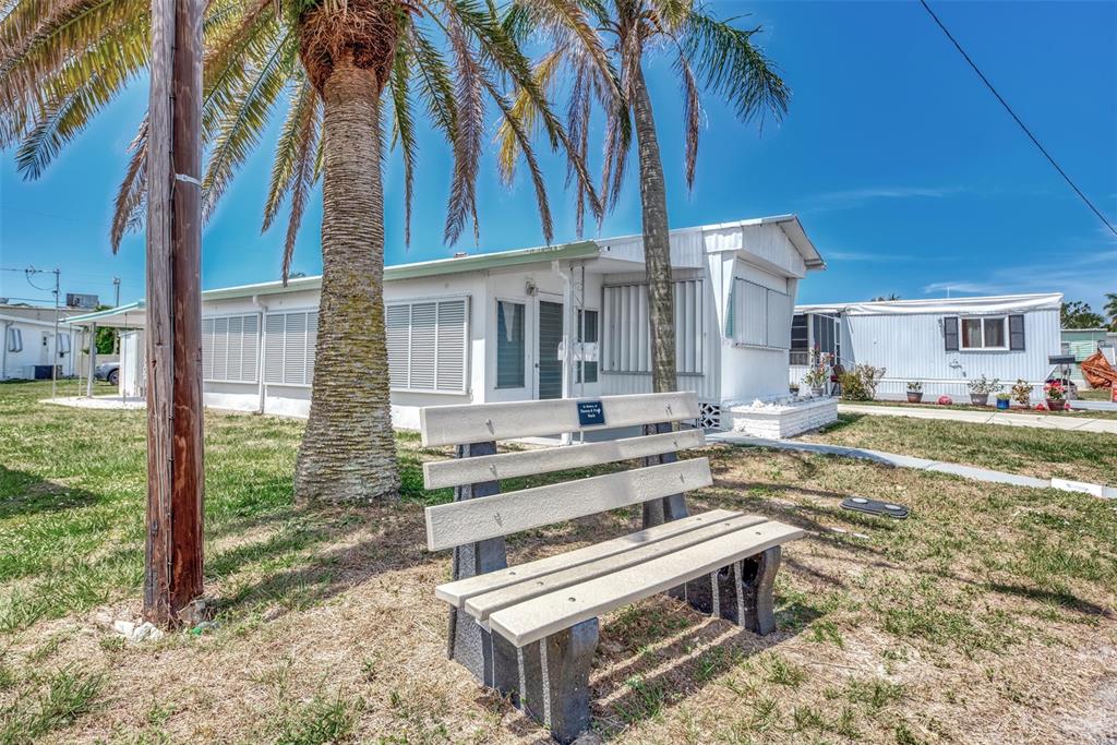 a front view of a house with a yard table and chairs