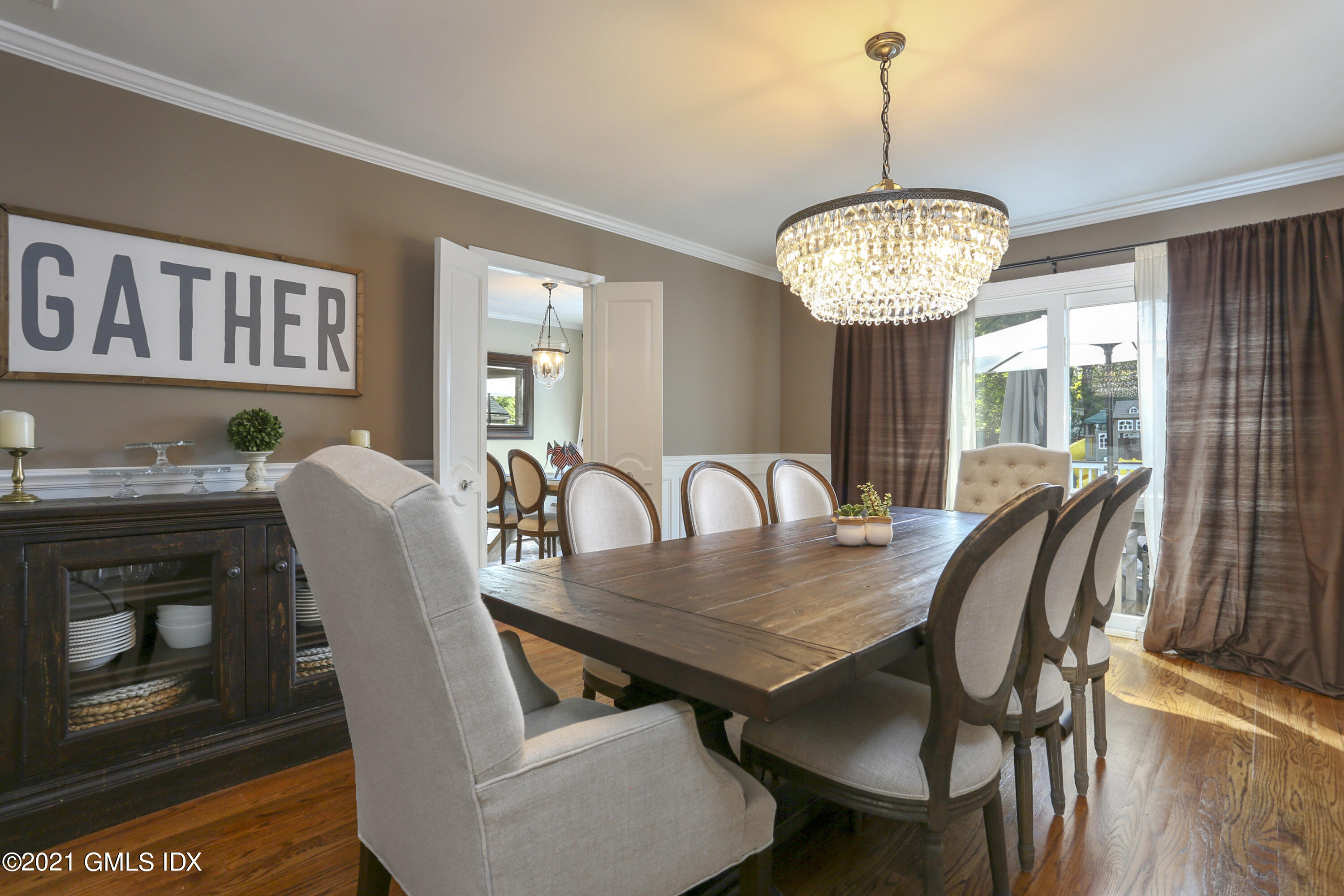236 Palmer Hill Road Old Greenwich, CT 06870 - Photo 1 of 33 a view of a dining room with furniture wooden floor and chandelier
