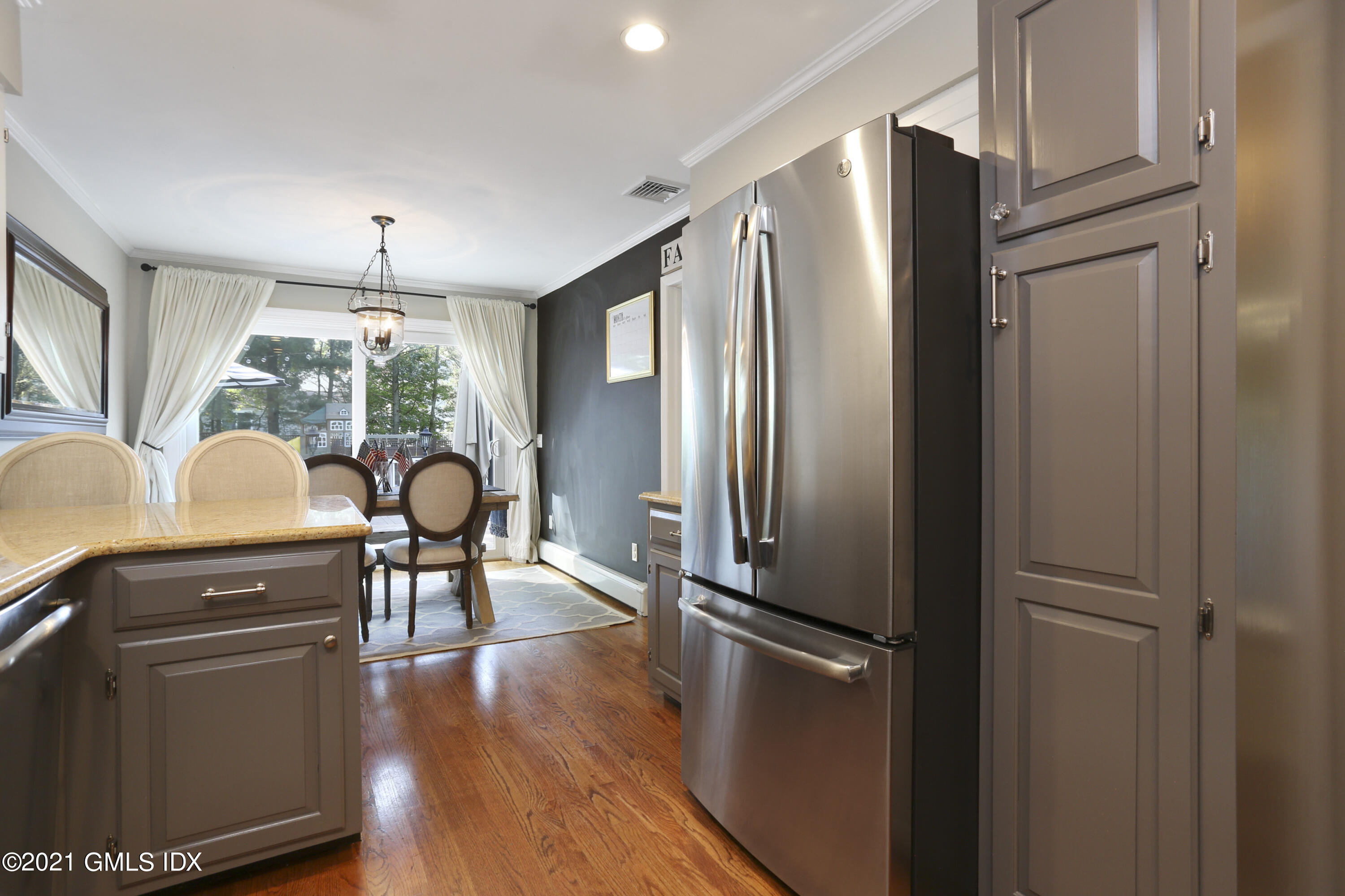 236 Palmer Hill Road Old Greenwich, CT 06870 - Photo 13 of 33 a kitchen with stainless steel appliances a refrigerator stove and wooden floor