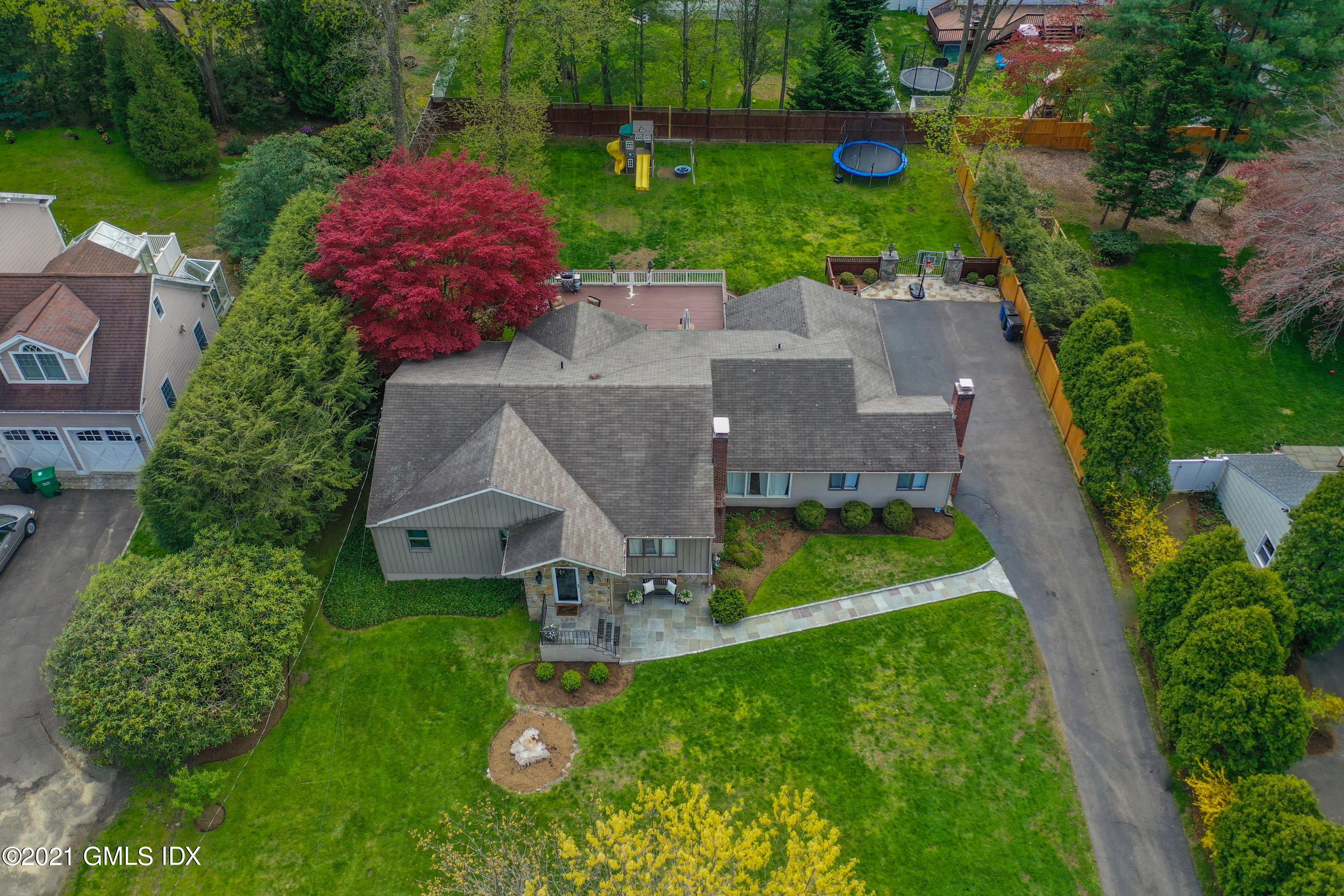 236 Palmer Hill Road Old Greenwich, CT 06870 - Photo 2 of 33 an aerial view of a house with swimming pool a yard and outdoor seating