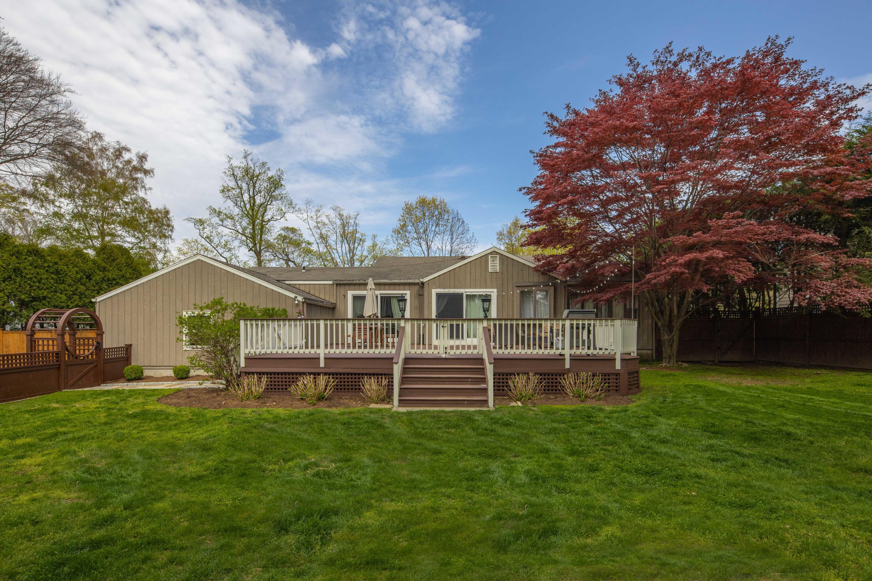 236 Palmer Hill Road Old Greenwich, CT 06870 - Photo 23 of 33 a front view of a house with a garden