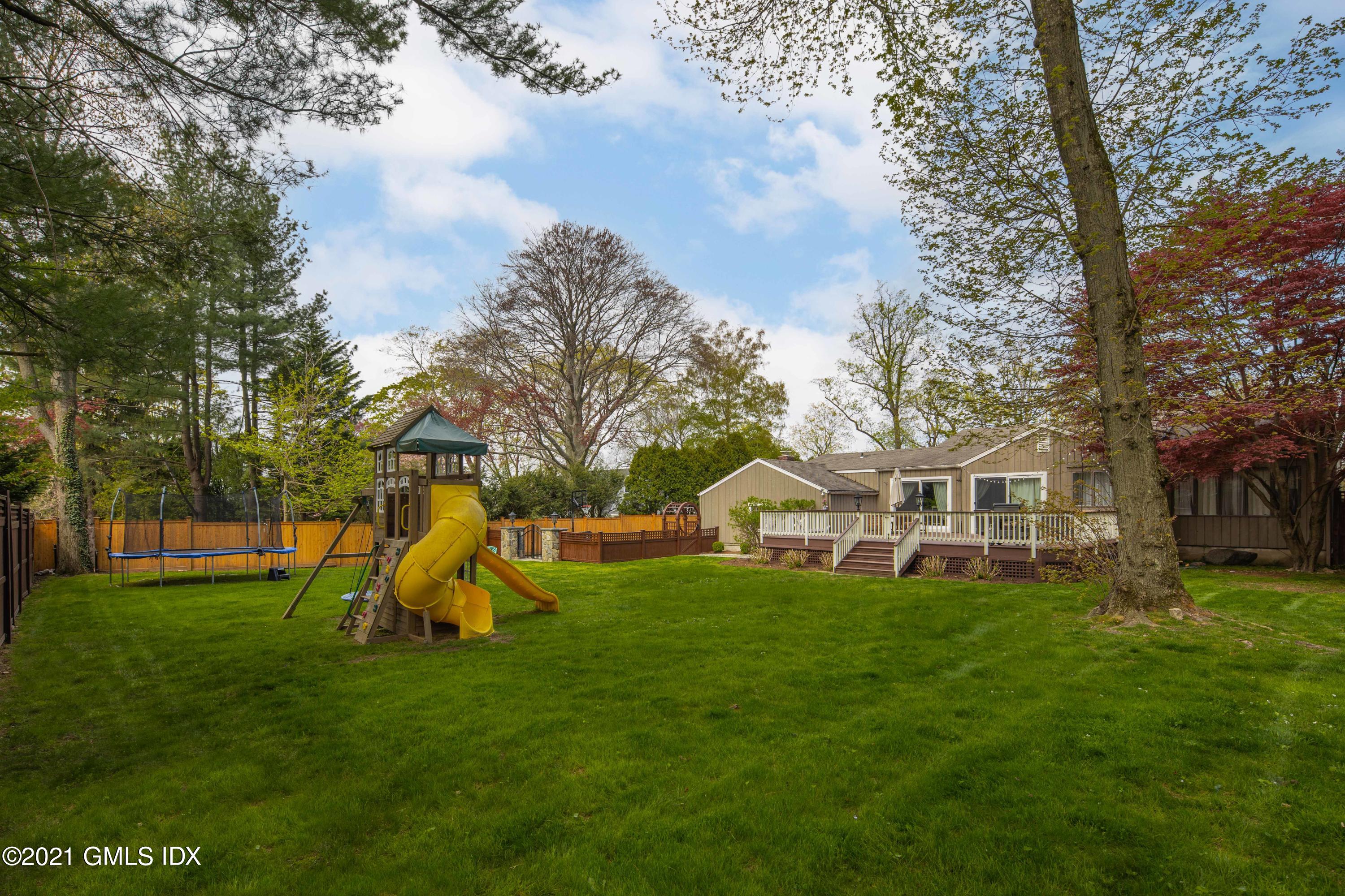 236 Palmer Hill Road Old Greenwich, CT 06870 - Photo 27 of 33 a view of a house with a big yard and sitting area