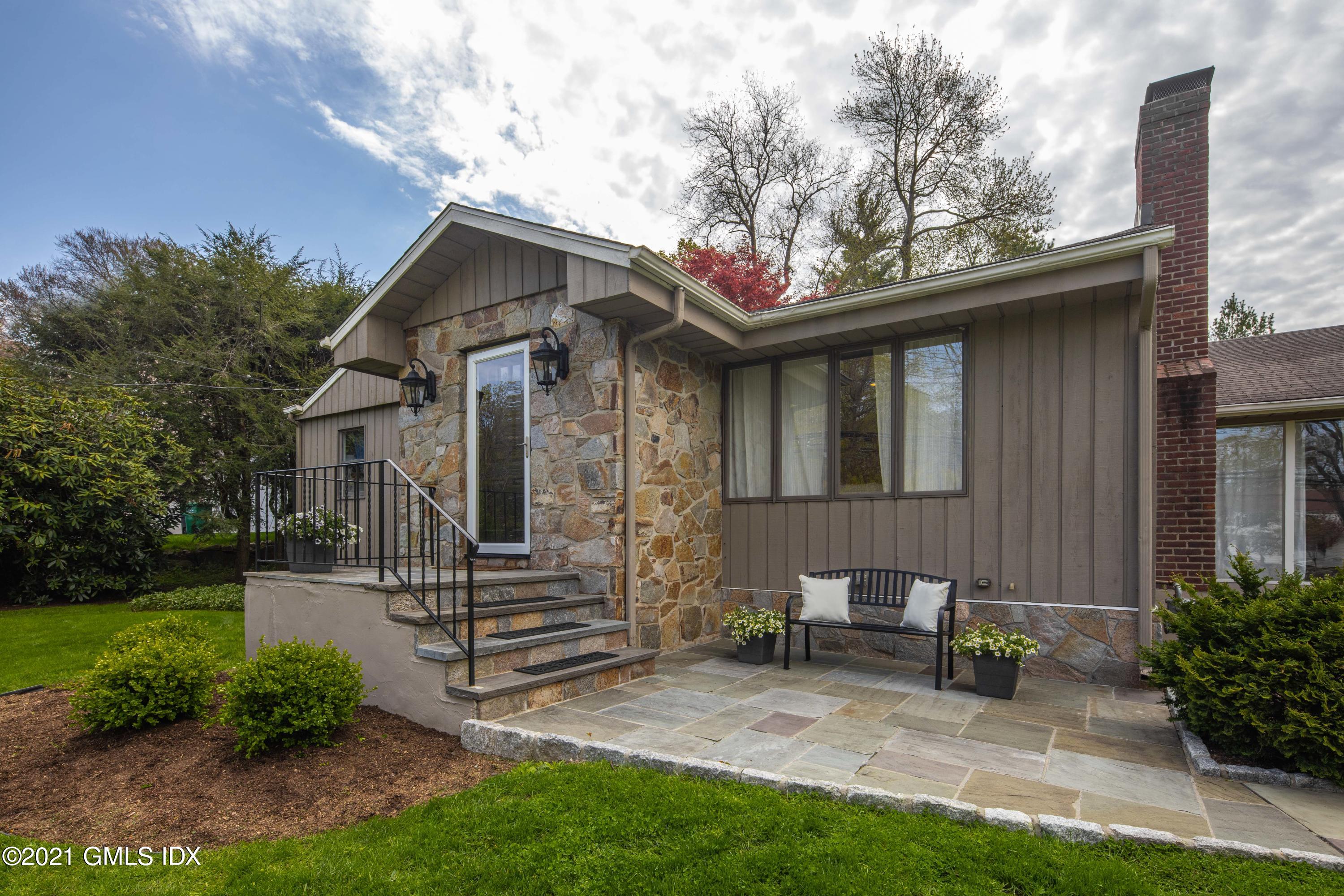 236 Palmer Hill Road Old Greenwich, CT 06870 - Photo 6 of 33 a view of a house with a yard and wooden fence