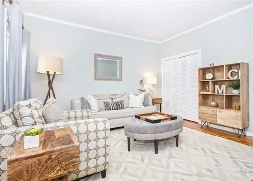 a living room with furniture and a table