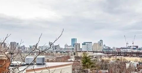 a view of a balcony with wooden floor