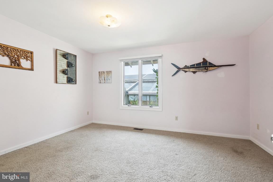 506 Lazy Lane Absecon, NJ 08201 - Photo 11 of 26 an empty room with windows