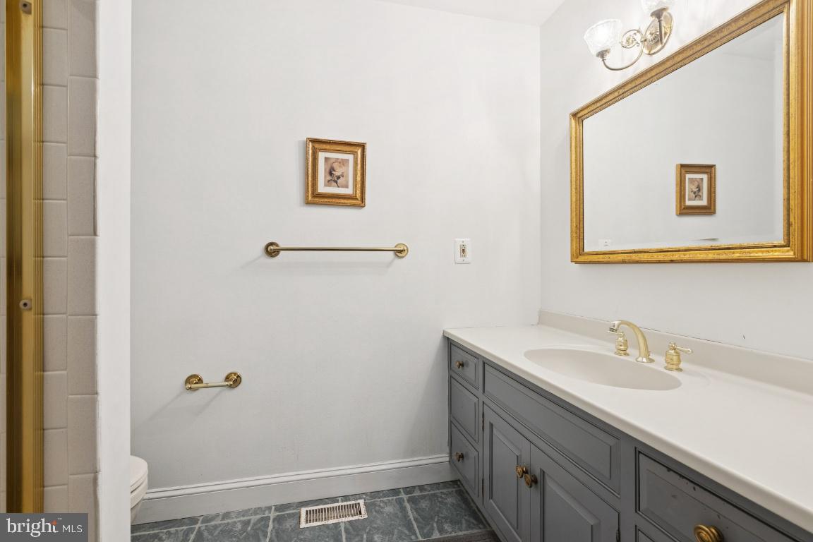 506 Lazy Lane Absecon, NJ 08201 - Photo 13 of 26 a bathroom with a sink and mirror