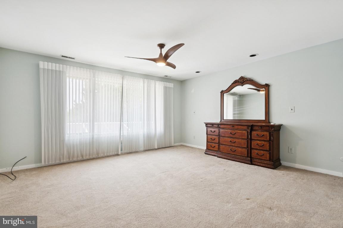 506 Lazy Lane Absecon, NJ 08201 - Photo 15 of 26 an empty room with windows and cabinet