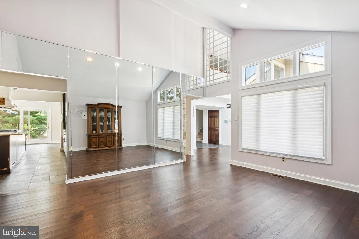 506 Lazy Lane Absecon, NJ 08201 - Photo 4 of 26 an empty room with wooden floor and windows