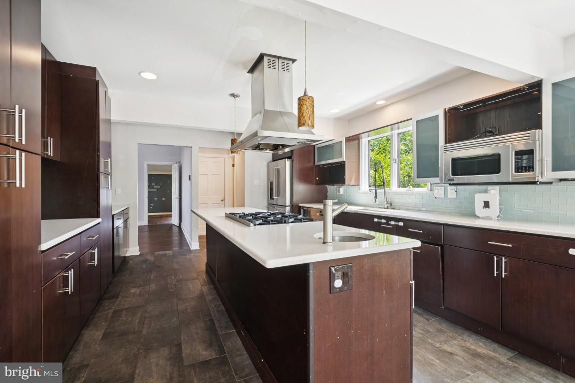 506 Lazy Lane Absecon, NJ 08201 - Photo 7 of 26 a kitchen with stainless steel appliances granite countertop a sink stove and refrigerator