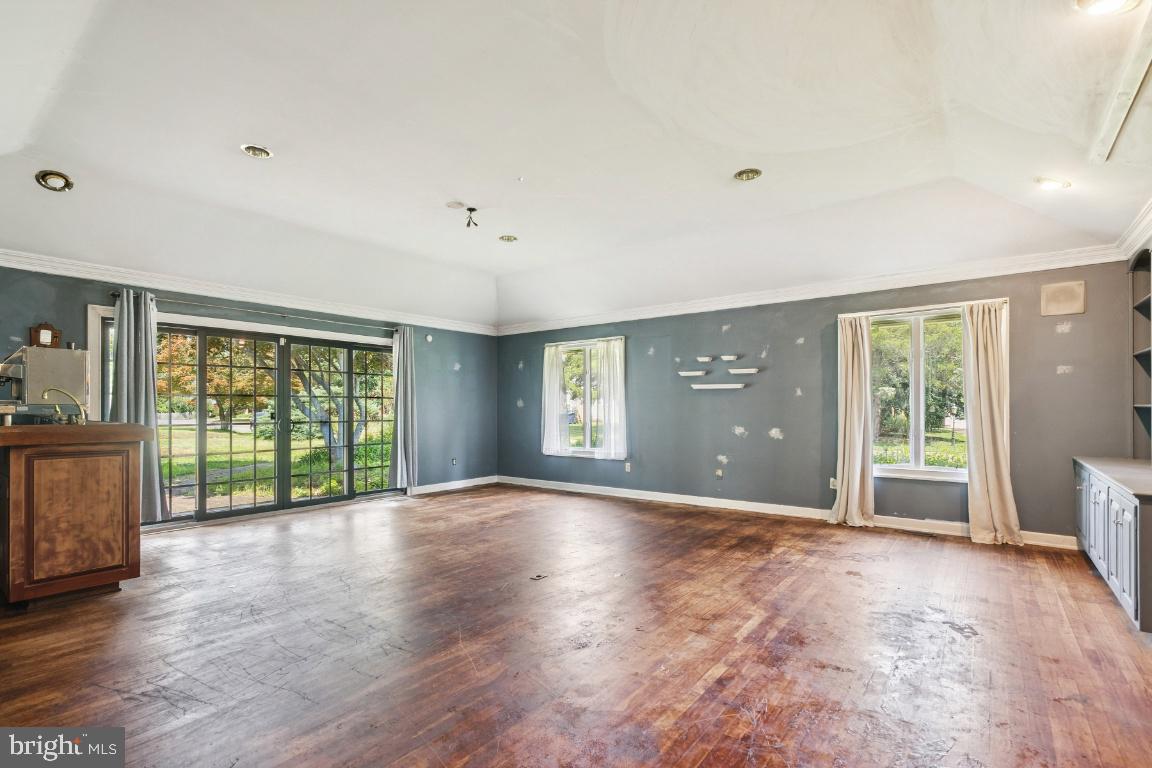 506 Lazy Lane Absecon, NJ 08201 - Photo 9 of 26 a view of an empty room with a window and wooden floor
