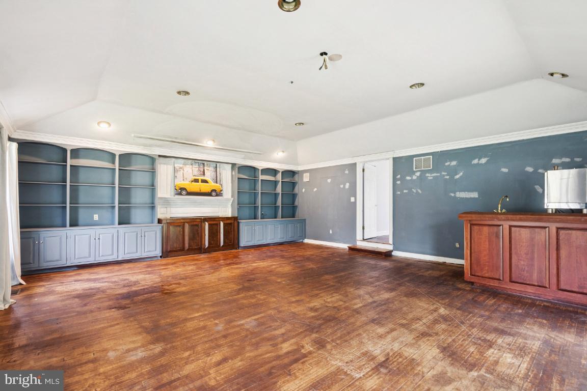 506 Lazy Lane Absecon, NJ 08201 - Photo 10 of 26 a view of an empty room with a window and a kitchen