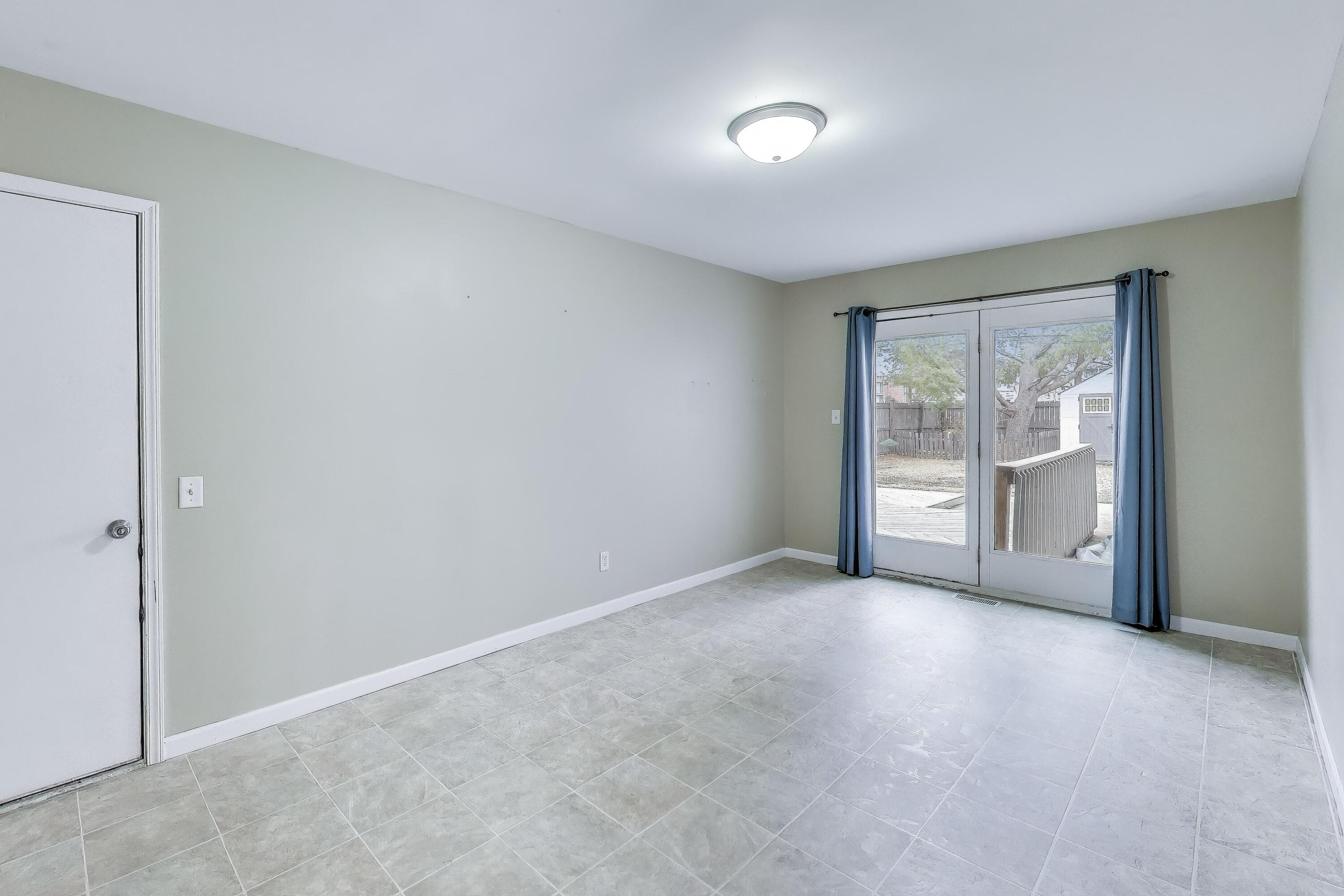 816 East 39th Lane Griffith, IN 46319 - Photo 11 of 42 a view of an empty room with a window