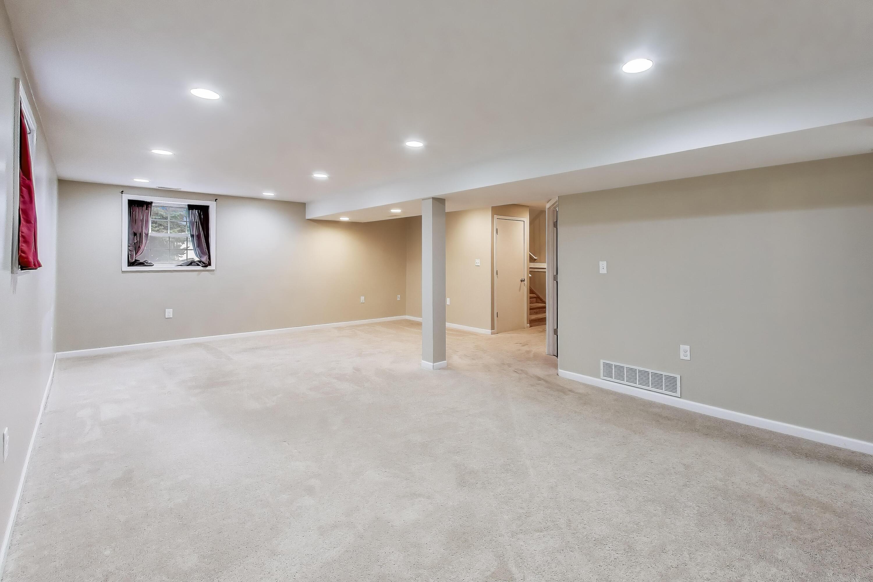 816 East 39th Lane Griffith, IN 46319 - Photo 25 of 42 an empty room with wall & windows