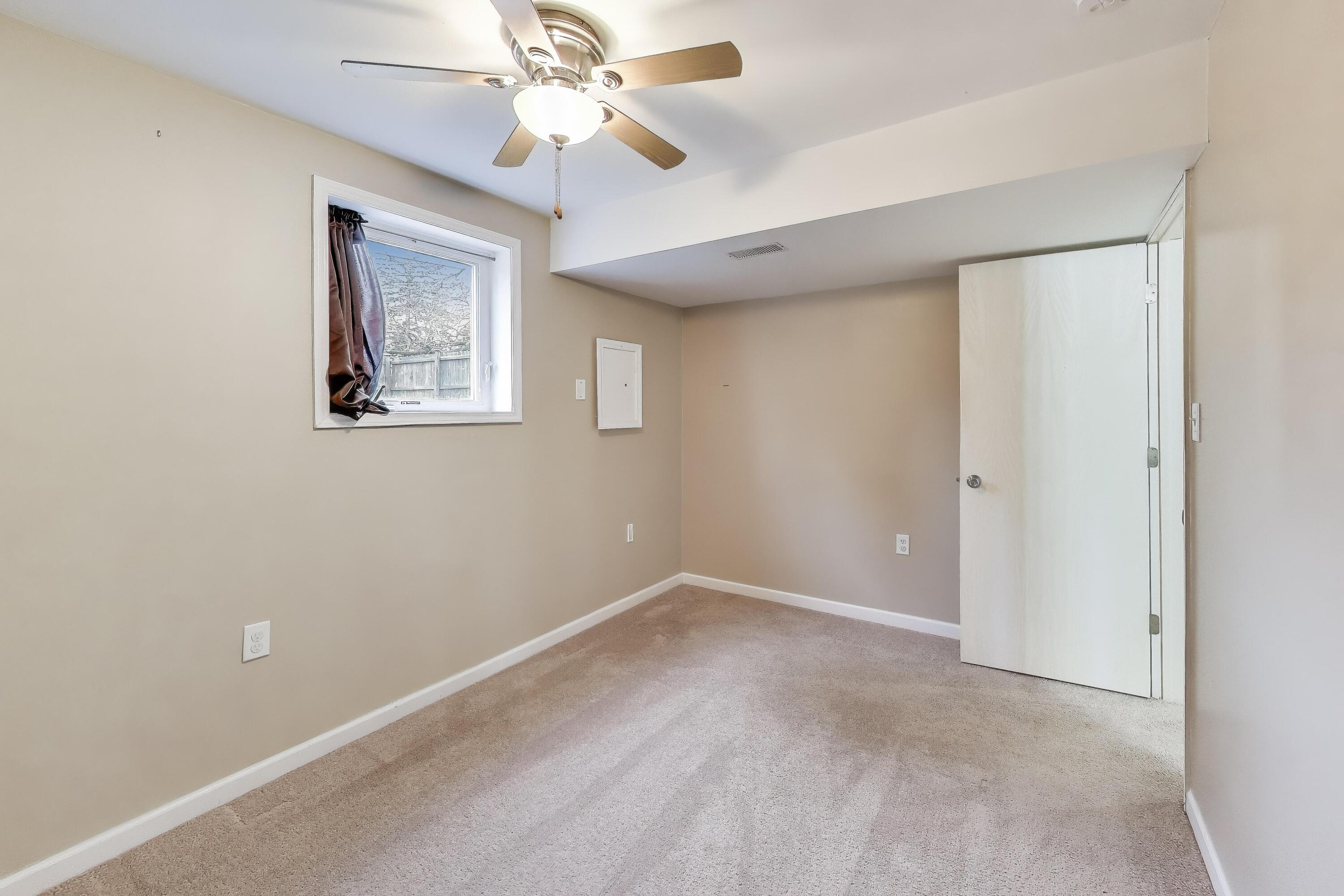 816 East 39th Lane Griffith, IN 46319 - Photo 27 of 42 a view of an empty room with a window