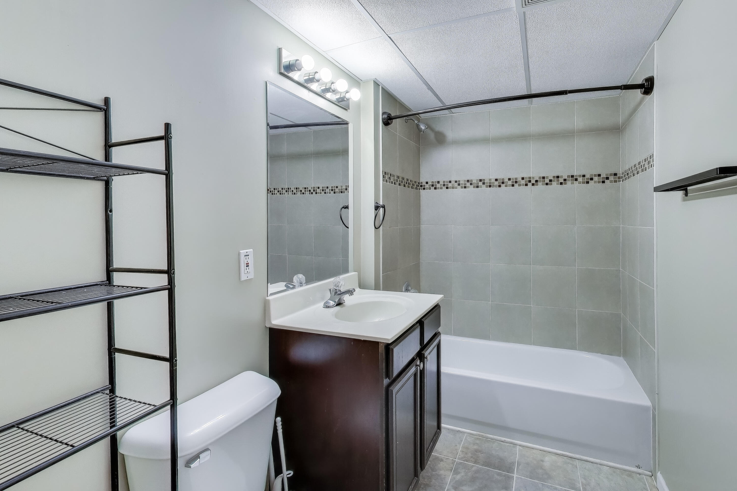 816 East 39th Lane Griffith, IN 46319 - Photo 30 of 42 a bathroom with a sink and a mirror