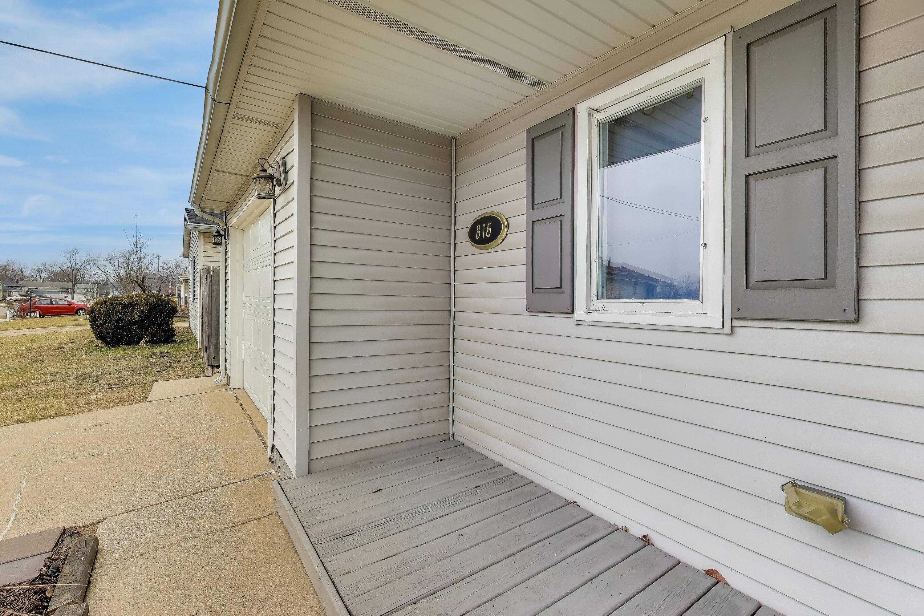 816 East 39th Lane Griffith, IN 46319 - Photo 3 of 42 a view of a door and a window