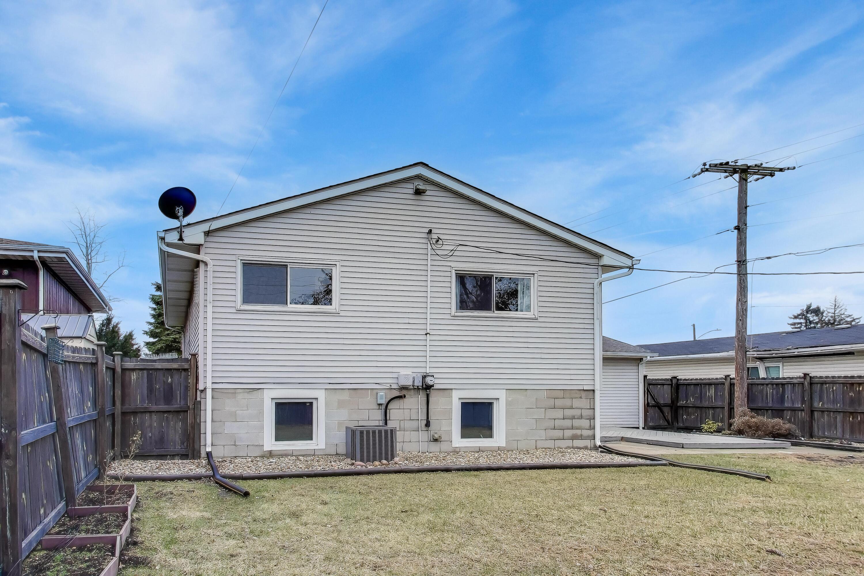 816 East 39th Lane Griffith, IN 46319 - Photo 36 of 42 a view of a house with iron stairs