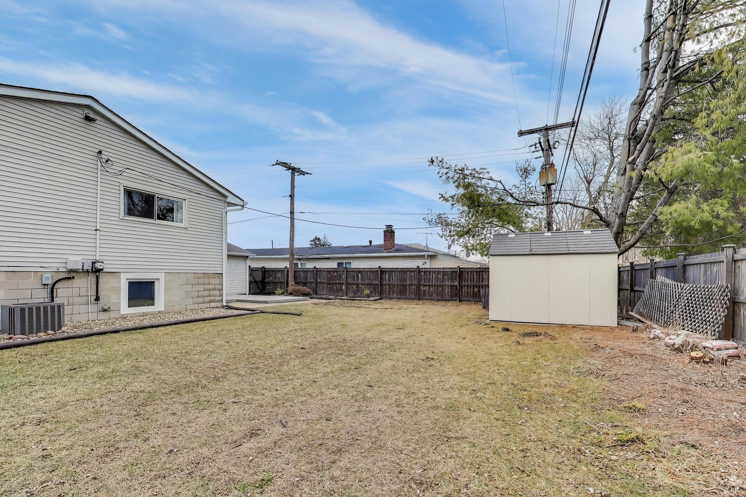 816 East 39th Lane Griffith, IN 46319 - Photo 39 of 42 a view of a house with a patio