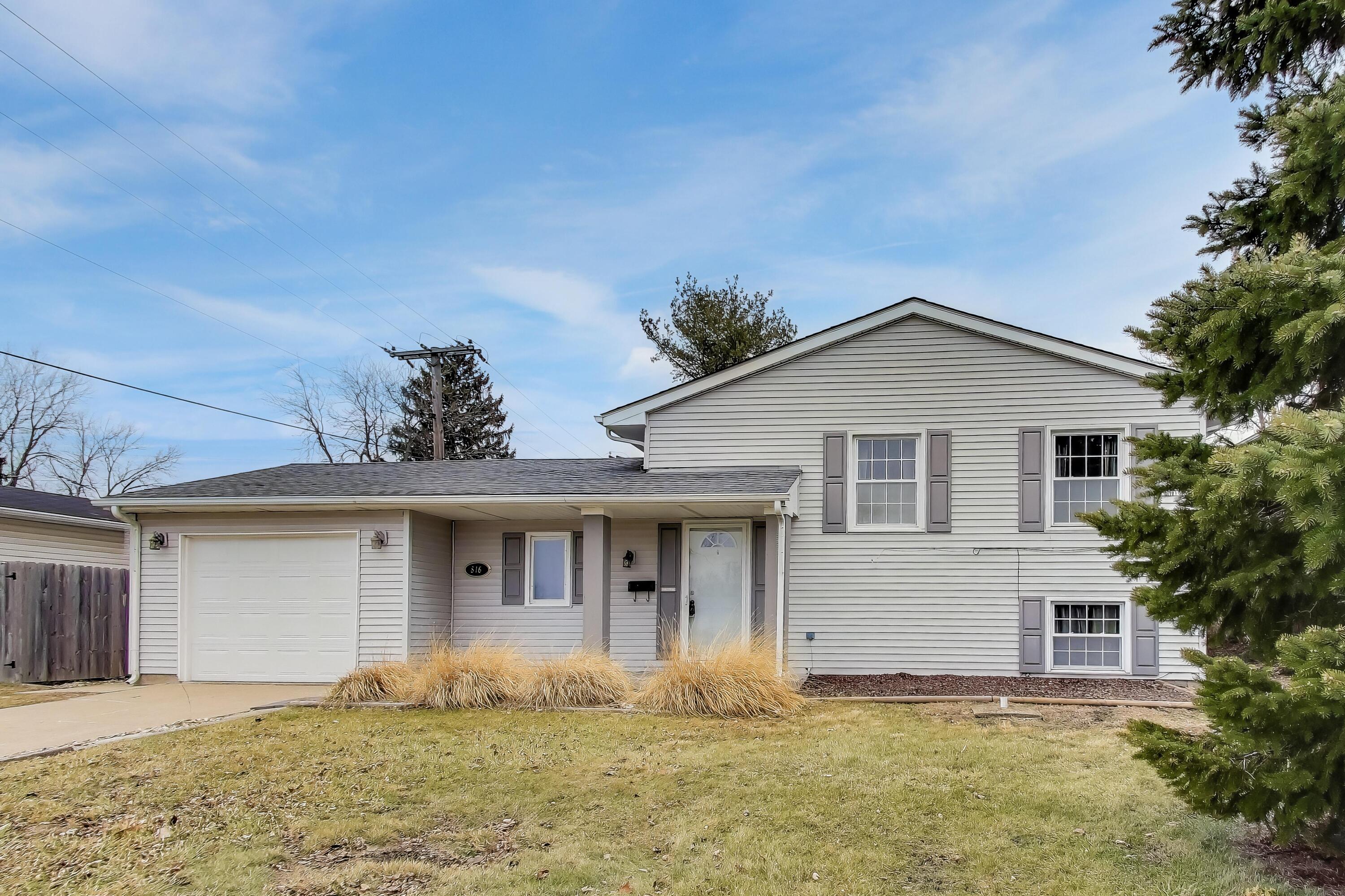 816 East 39th Lane Griffith, IN 46319 - Photo 42 of 42 a front view of a house with a yard