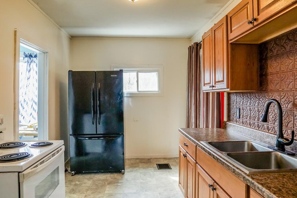 26 Summit Avenue Athol, MA 01331 - Photo 14 of 30 a kitchen with a refrigerator and a sink