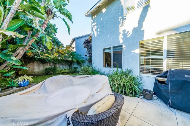 a wooden bench sitting in front of a building