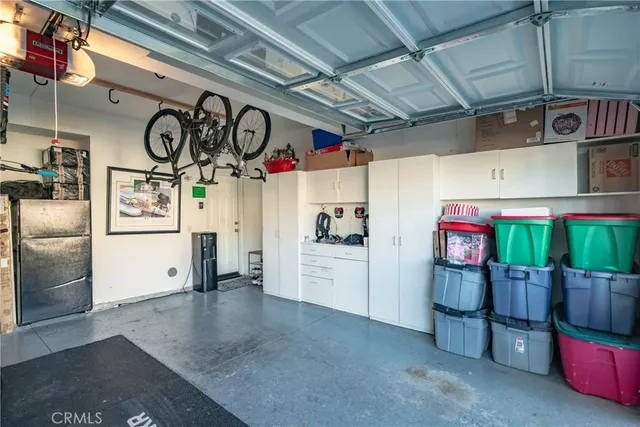a kitchen with stainless steel appliances granite countertop a refrigerator and microwave
