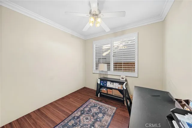 a view of room with window and wooden floor