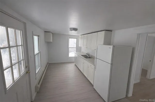 a view of a hallway with windows