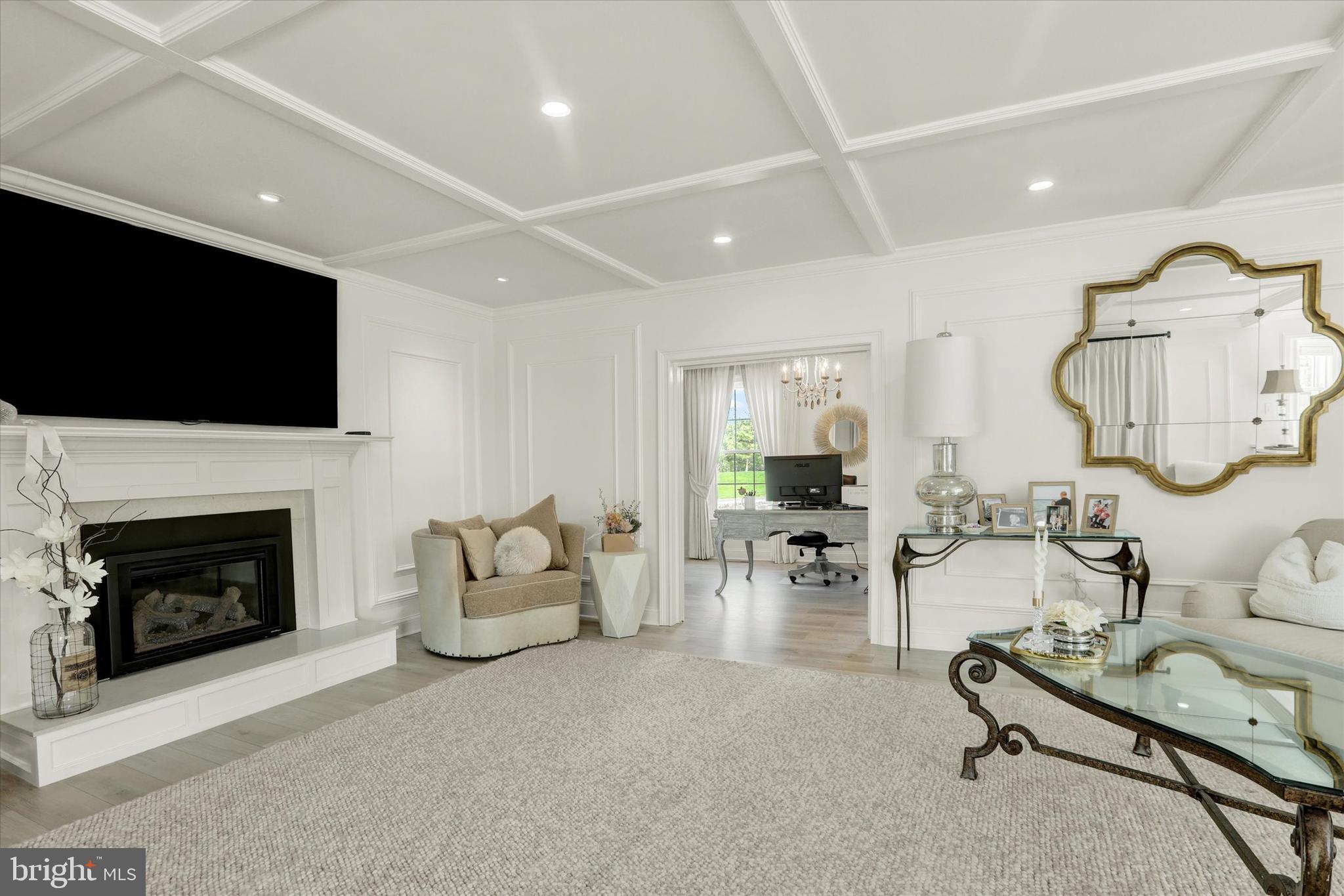 1071 Highland Road Newtown, PA 18940 - Photo 11 of 40 a living room with furniture a fireplace and a flat screen tv