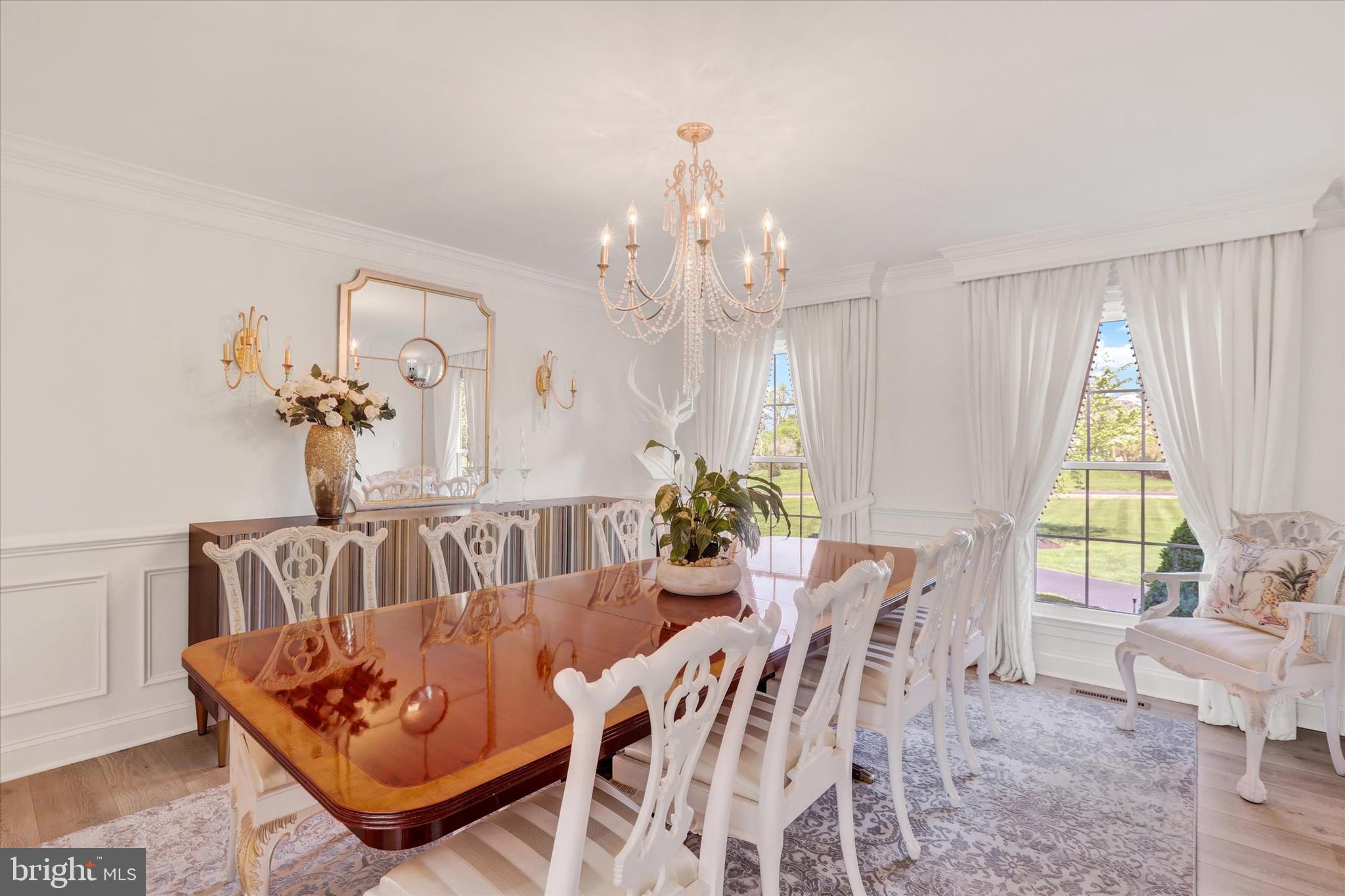 1071 Highland Road Newtown, PA 18940 - Photo 17 of 40 a view of a dining room with furniture and a chandelier