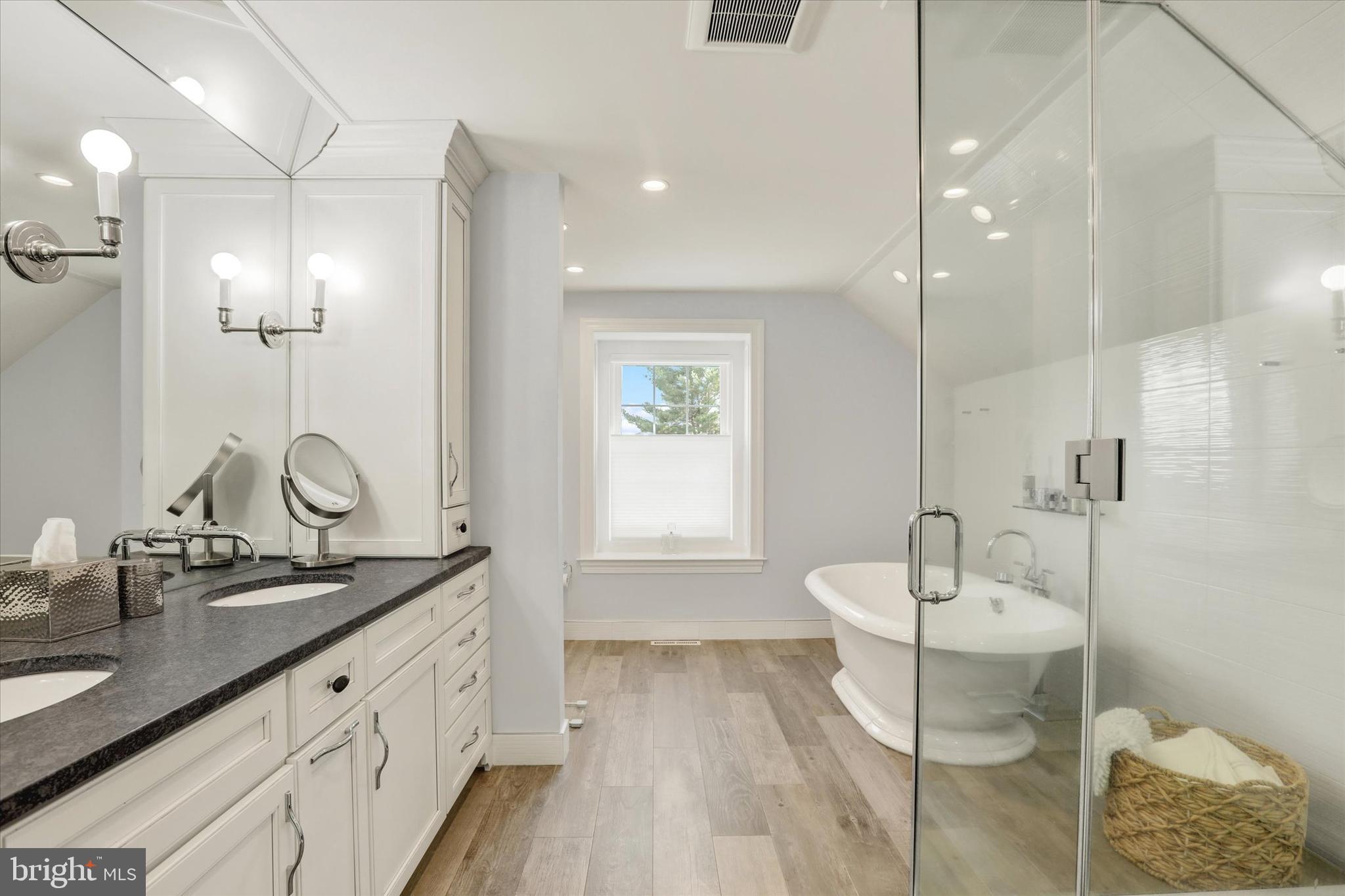1071 Highland Road Newtown, PA 18940 - Photo 26 of 40 a spacious bathroom with a double vanity sink a mirror and a shower