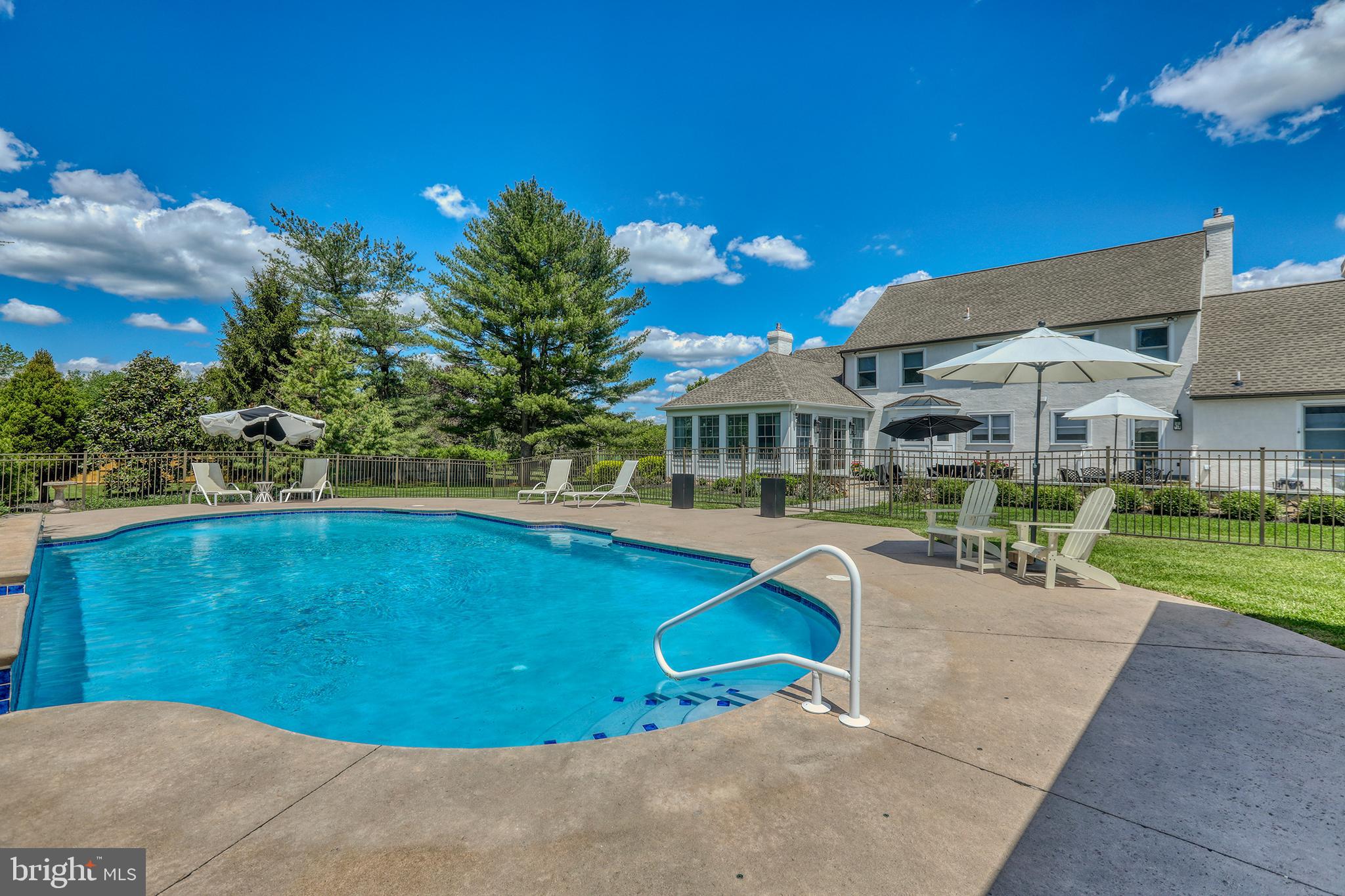 1071 Highland Road Newtown, PA 18940 - Photo 38 of 40 a view of a swimming pool with a patio and a yard