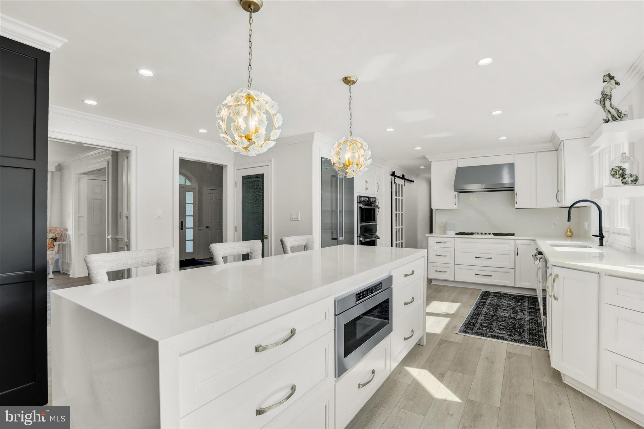 1071 Highland Road Newtown, PA 18940 - Photo 8 of 40 a large white kitchen with sink and white cabinets