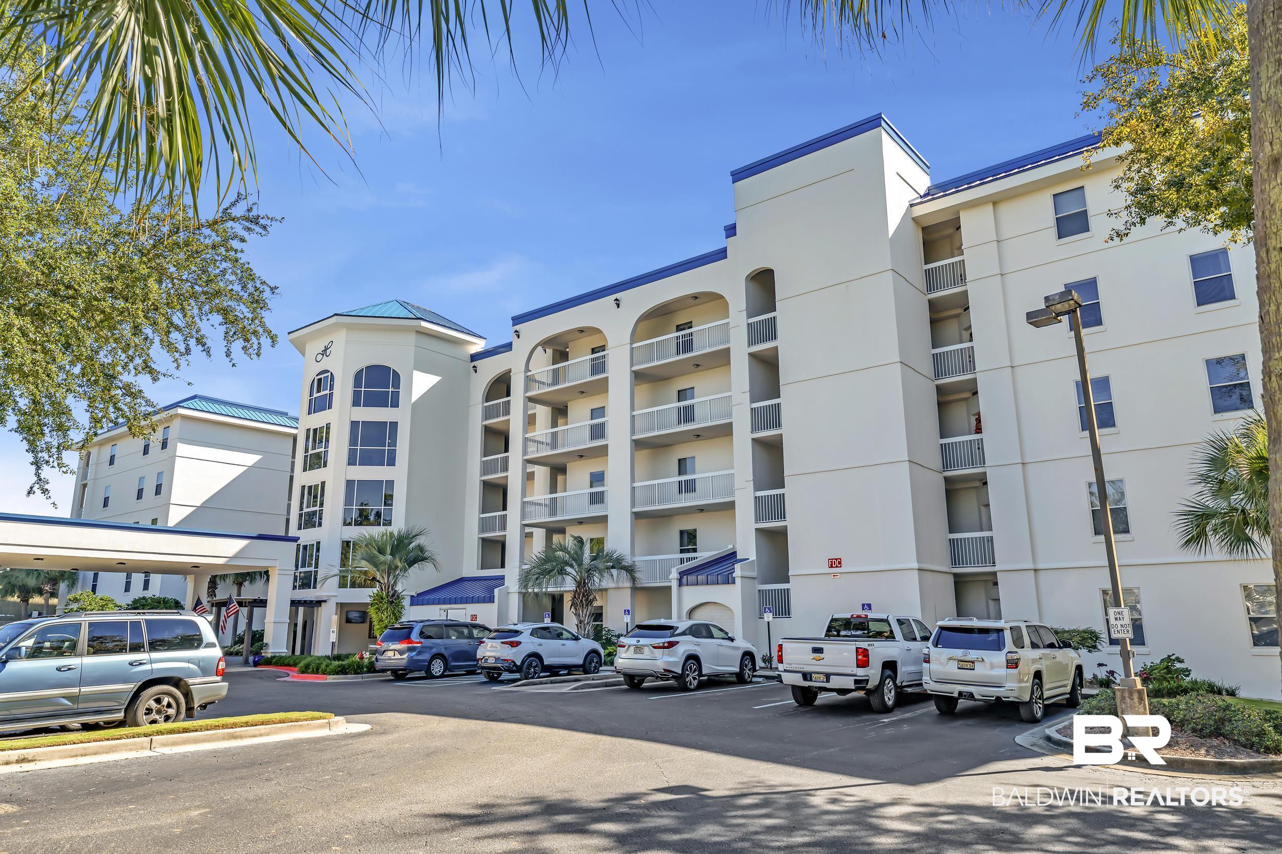 27282 Canal Road, Unit 104 Orange Beach, AL 36561 - Photo 63 of 79 View of apartment building / complex with uncovered parking