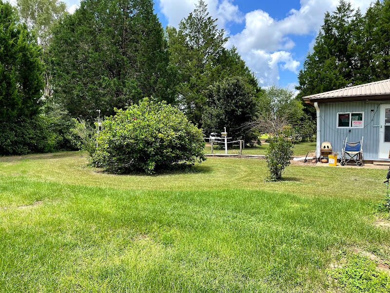 5161 Griffith Mill Road Holt, FL 32564 - Photo 9 of 25 a view of a backyard with garden