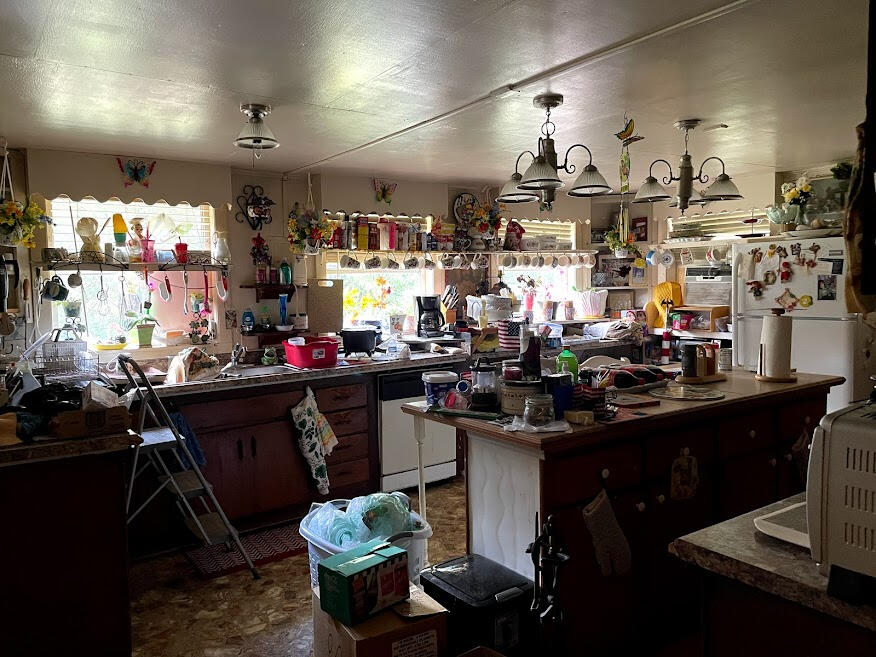 5161 Griffith Mill Road Holt, FL 32564 - Photo 10 of 25 a kitchen filled with a sink a stove and a wooden cabinets