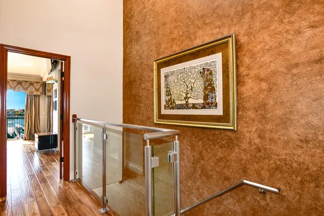 a bedroom with a bed and a ceiling fan