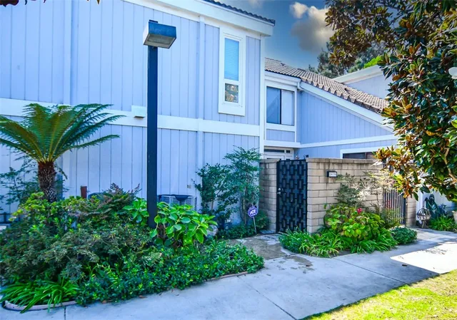 a view of swimming pool with outdoor seating and lots of buildings in the background
