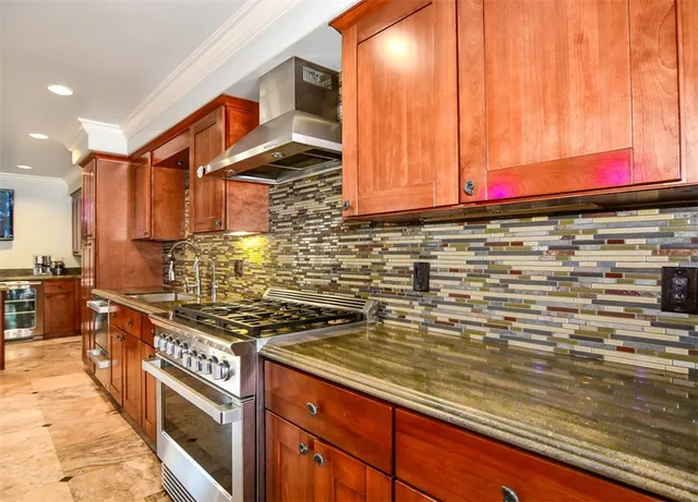 a dining room with furniture a large window and wooden floor