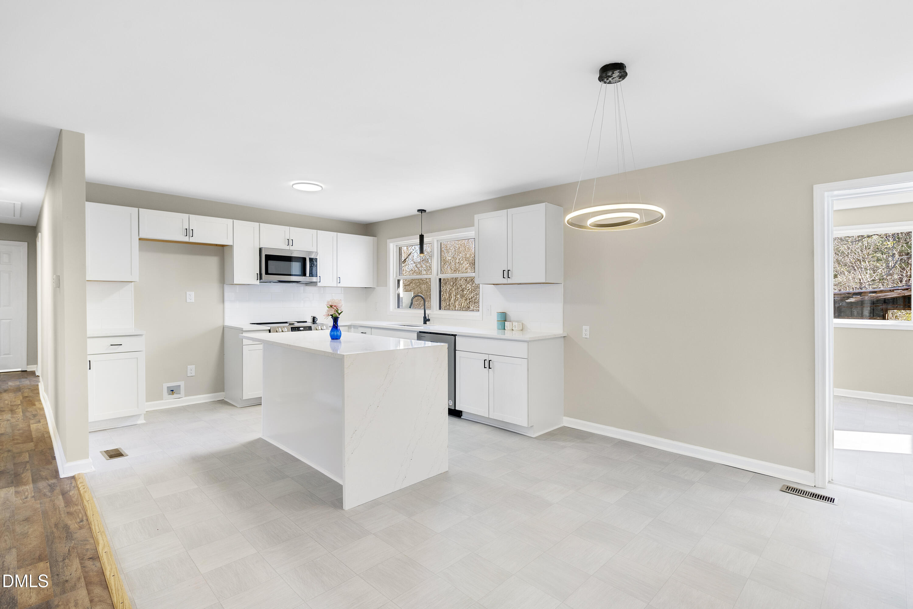 231 Faith Church Road Four Oaks, NC 27524 - Photo 23 of 47 a kitchen with white cabinets and white appliances