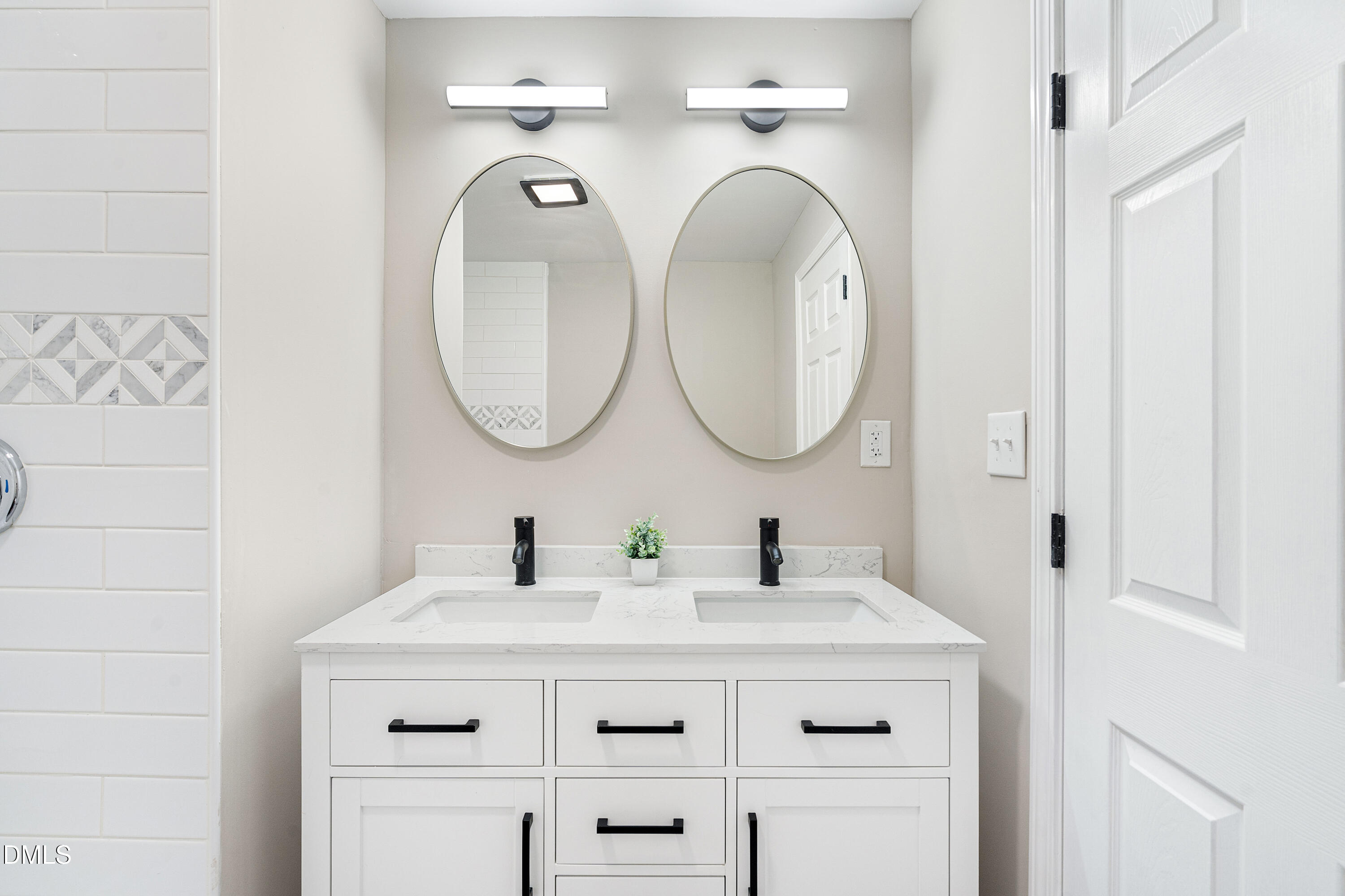 231 Faith Church Road Four Oaks, NC 27524 - Photo 27 of 47 a bathroom with a sink and a mirror